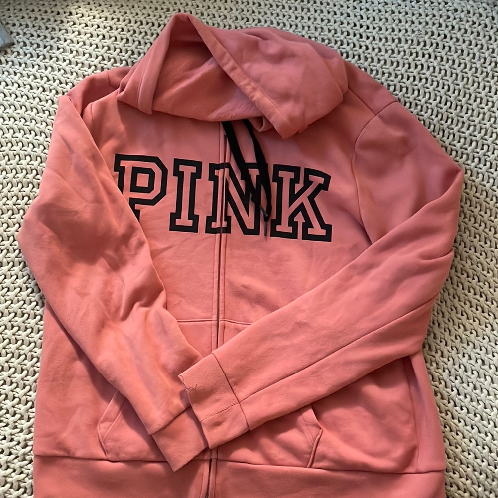 A coral pink sweater. Worn only once. Very soft and comfortable.